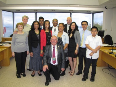 Mayor Rick Cooper with the twelve new citizens.